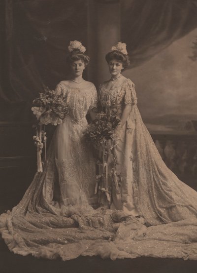 Mrs. Arthur Lee and Miss Faith Moore, American sisters, wearing dress for presentation at the court of Edward VII, c.1905 by English Photographer